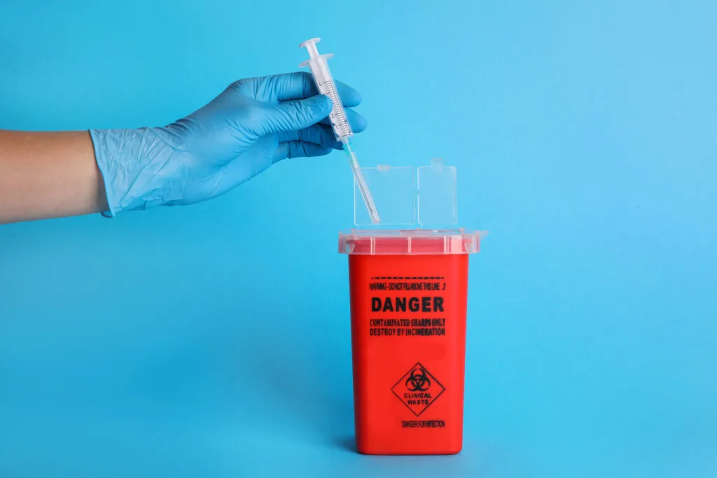 medical sharps disposal with glove and syringe 2026 03 27 01 21 15 utc